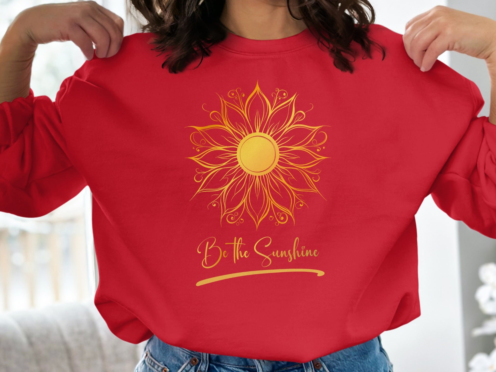 Bright red crewneck sweatshirt with uplifting Be the Sunshine inspirational message, unisex fit, and cotton-blend fabric.