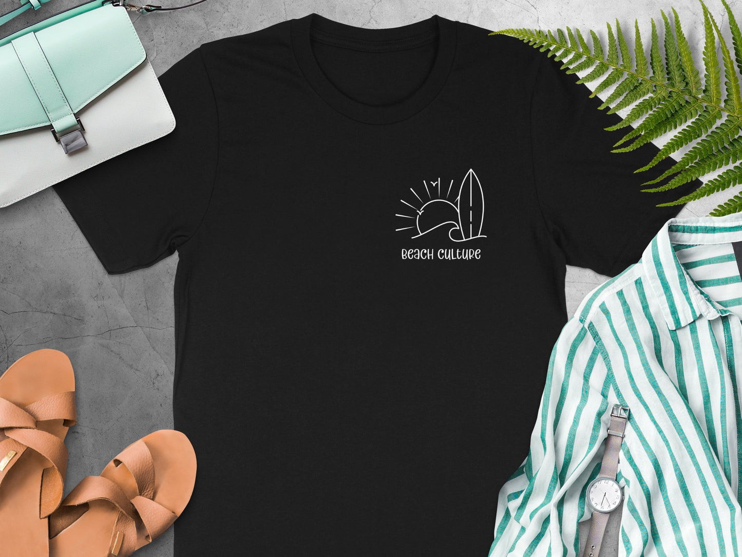 Black Beach Culture t-shirt showing a subtle left-chest white typography design with minimalist surf-inspired line art.