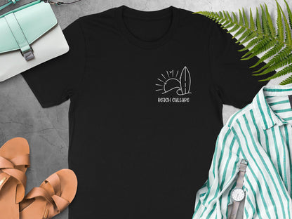 Black Beach Culture t-shirt showing a subtle left-chest white typography design with minimalist surf-inspired line art.