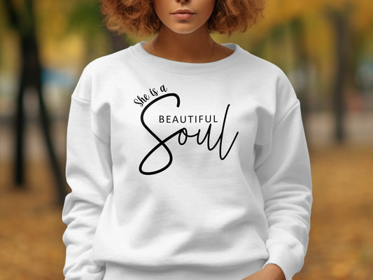 White Beautiful Soul women’s long sleeve sweatshirt, cozy crew neck and ribbing with elegant, inspiring front quote design.
