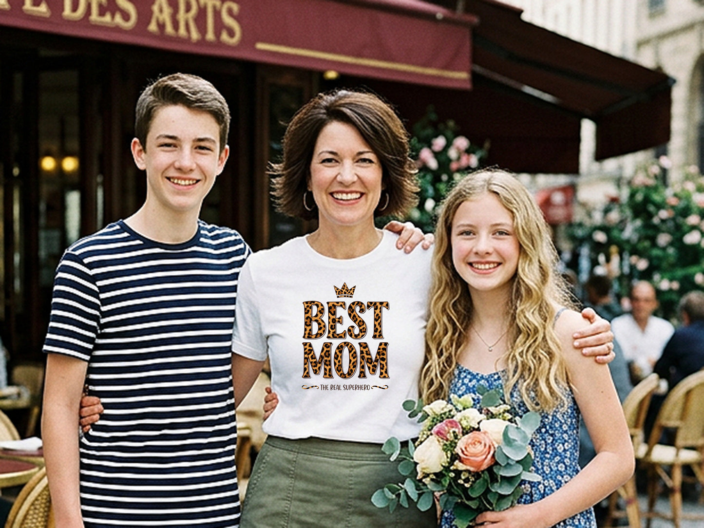 Mom wearing Best Mom The Real Superhero T-Shirt celebrating Mother’s Day with kids, smiling and joyful.