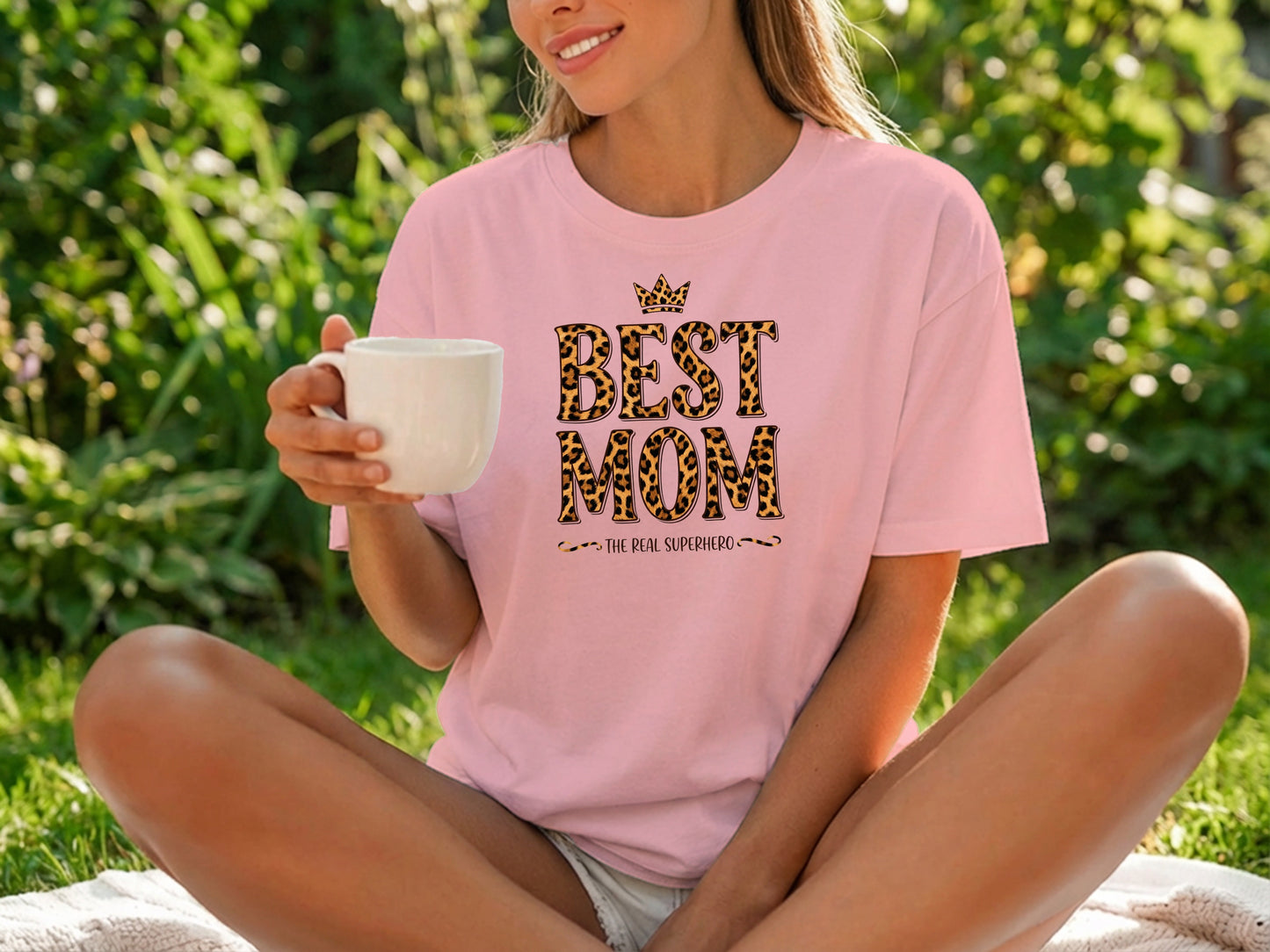 Best Mom The Real Superhero T-Shirt in pink, retail-inspired drape with comfortable unisex sizing.