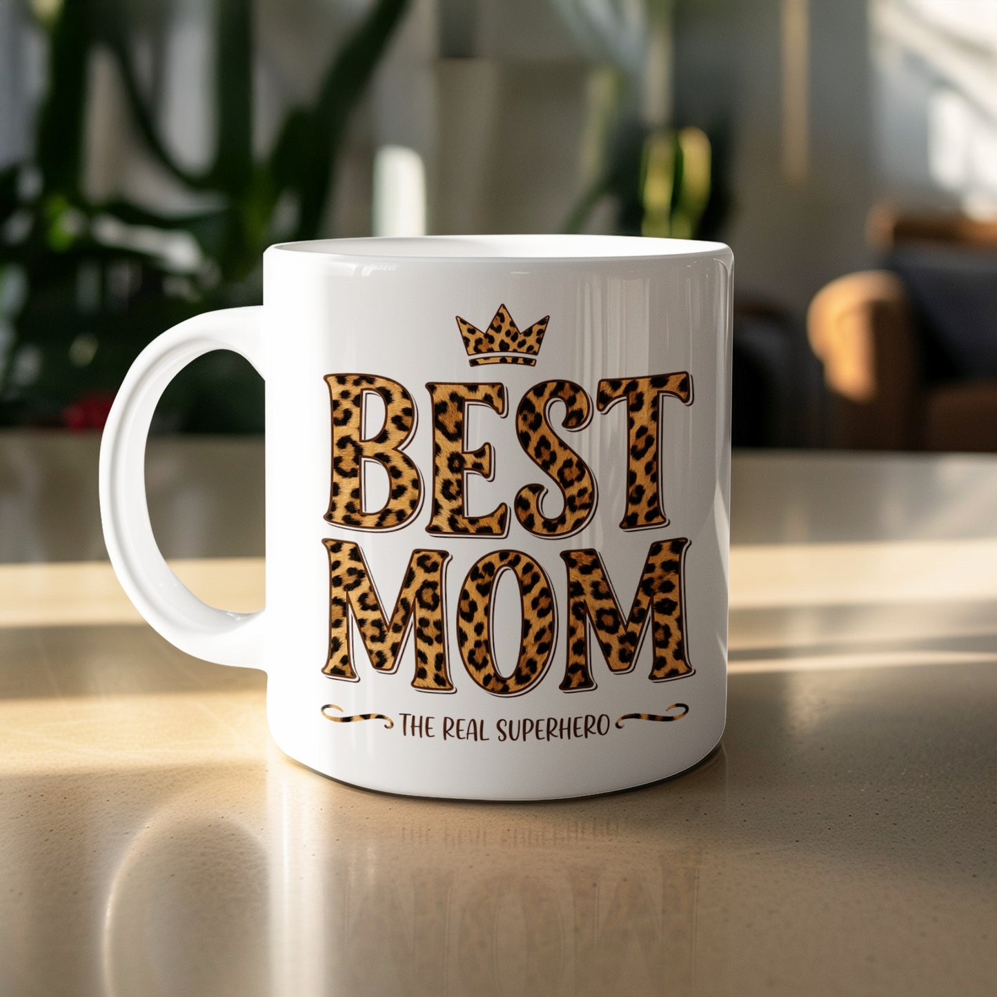 Best Mom The Real Superhero 11oz mug with leopard print on table, bold ceramic gift for stylish coffee moments.