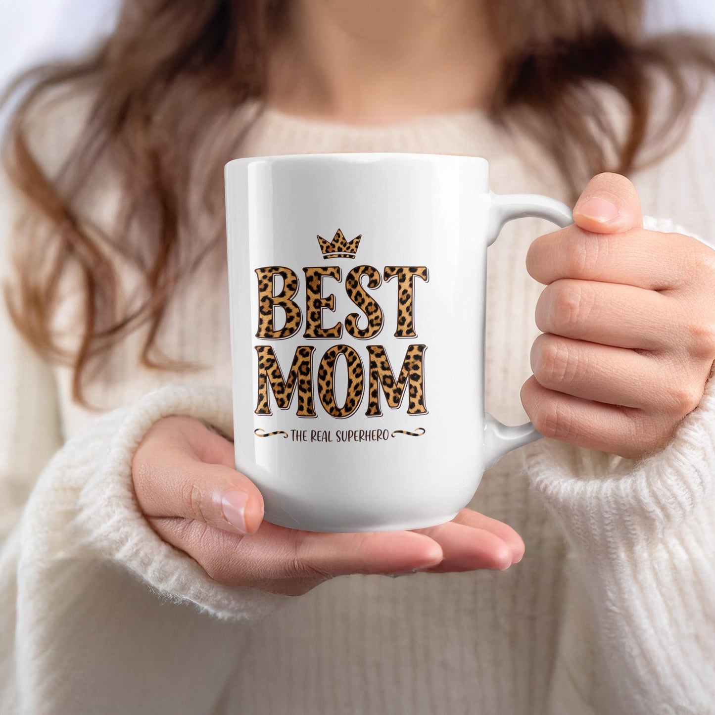 Lady holding 15oz Best Mom The Real Superhero mug, perfect for larger coffee servings and empowering gift moments.