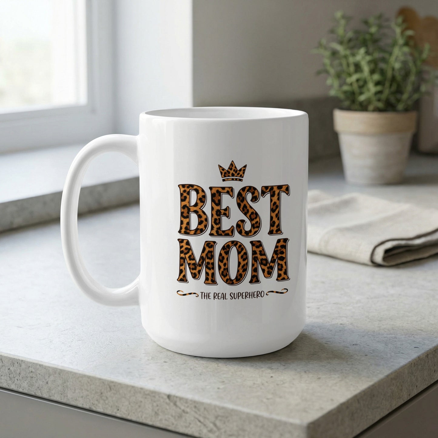 Best Mom The Real Superhero 15oz ceramic mug by window light, perfect for relaxing coffee and stylish gifting moments.