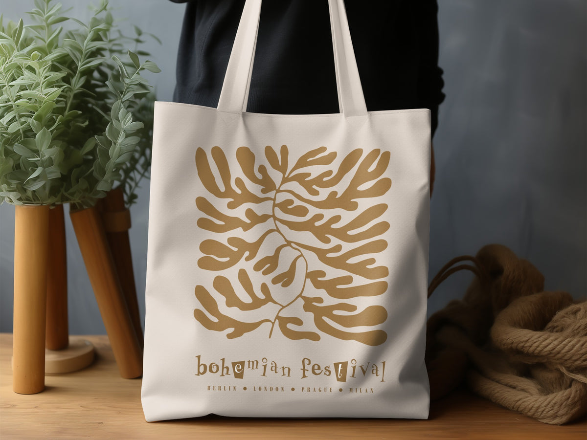 Natural-tone Bohemian Festival canvas tote bag in a lifestyle setting, highlighting the flat organic foliage and European city lettering beneath.