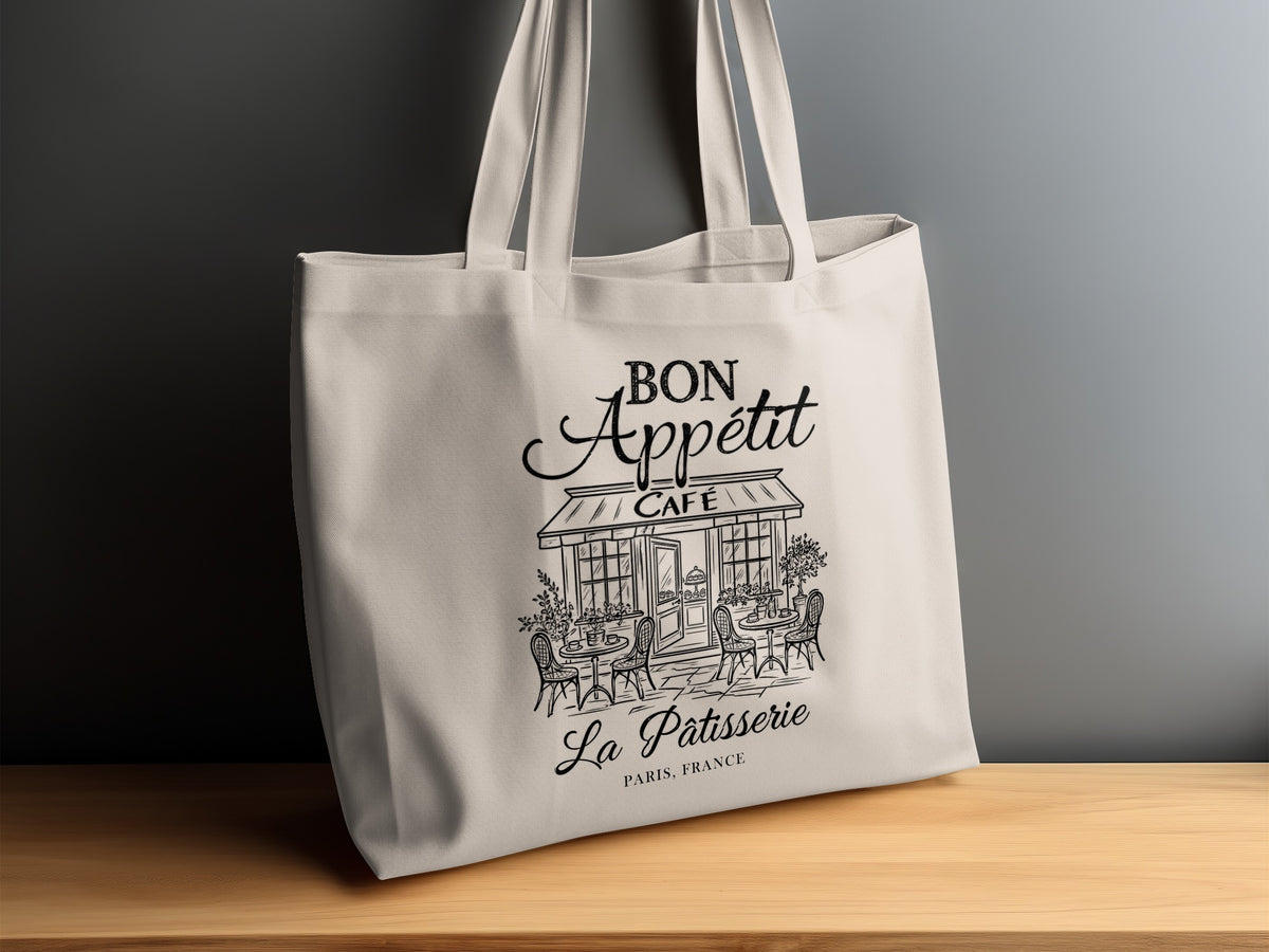 Vintage French café illustration featuring a striped CAFÉ awning, potted plants and bistro seating on a natural canvas tote bag.