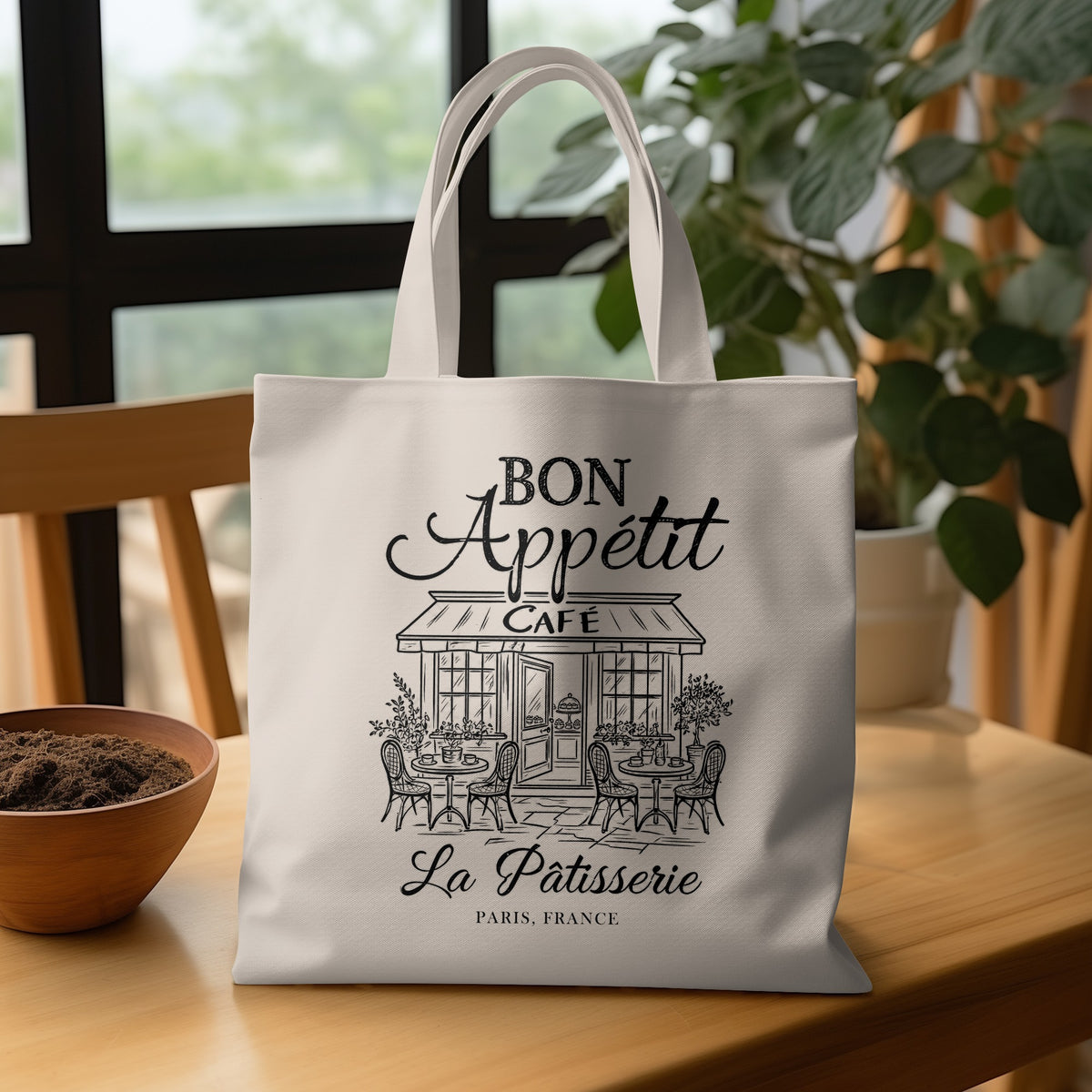 La Pâtisserie cotton canvas tote bag artwork with elegant black script lettering, a striped café awning and PARIS, FRANCE text below.