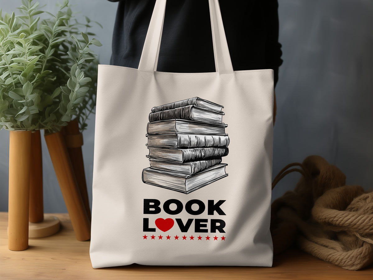 Book Lover Tote Bag lifestyle display with detailed book illustration, natural canvas, red heart and decorative red stars beneath.