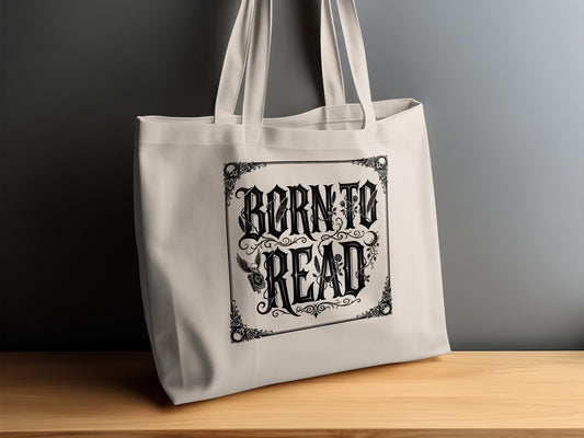 Born to Read Tote Bag on timber sideboard with roses, vine tendrils, skull motifs and intricate ornamental scrollwork.