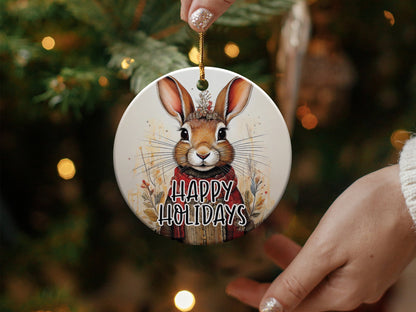 Bunny Christmas ceramic ornament featuring a watercolour rabbit with floral crown, botanical details, and Happy Holidays text.