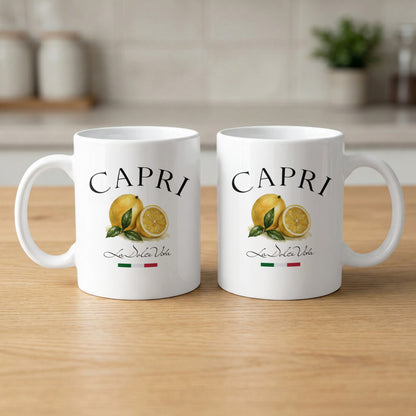 Front and back views of two Capri 11oz coffee mugs featuring the lemon illustration and La Dolce Vita design.