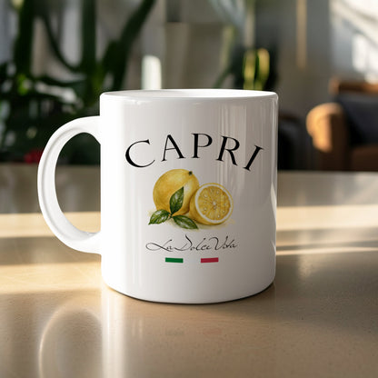 Capri 11oz ceramic mug featuring a yellow lemon illustration, green leaves and La Dolce Vita black lettering.
