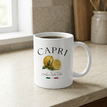 Capri 11oz ceramic coffee mug displayed on a kitchen bench, featuring lemon artwork and Italian lettering with green, white, and red flag details.