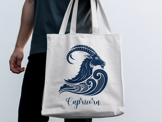 White Capricorn Tote Bag displaying a mythological sea-goat motif with elegant Capricorn script lettering.