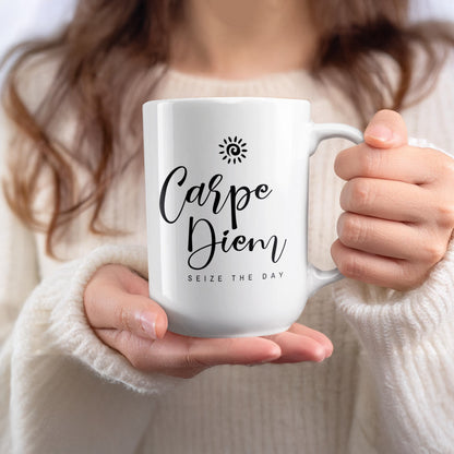 Handheld 15oz Carpe Diem Mug featuring flowing black script, Seize the Day uppercase subtitle and a small spiral sun icon.