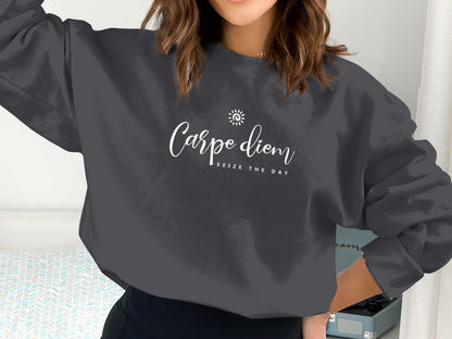 Carpe Diem Sweatshirt with small spiral sun chest graphic, flowing white script Carpe diem and spaced Seize The Day typography.
