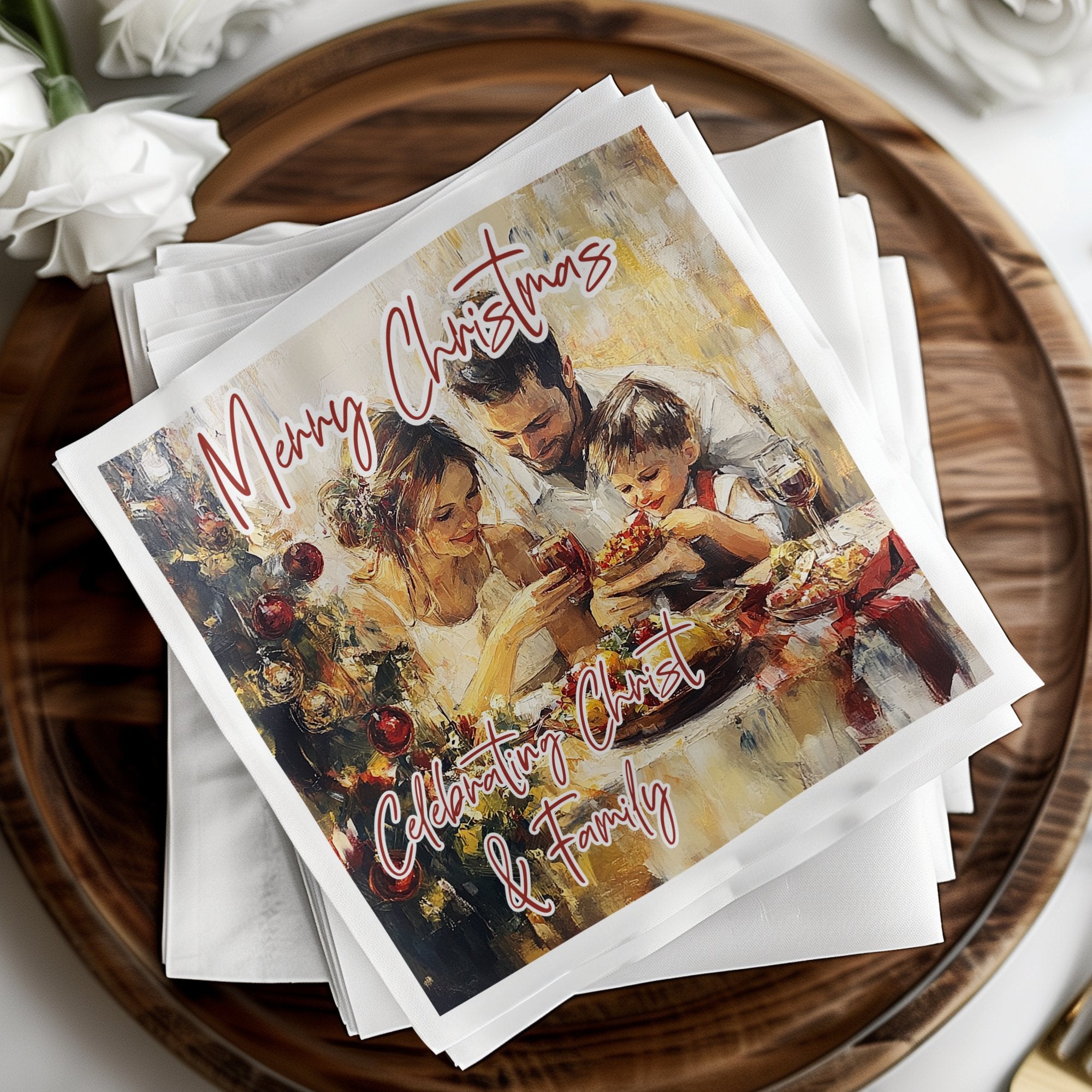 Religious festive napkins featuring painterly family Christmas artwork with Celebrating Christ lettering and warm tonal palette.