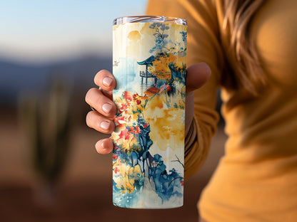 Floral tumbler in hand with cherry blossom print, 20oz insulated and perfect for travel or home
