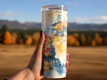 Woman using cherry blossom tumbler, featuring skinny straight design and soft pink blooms