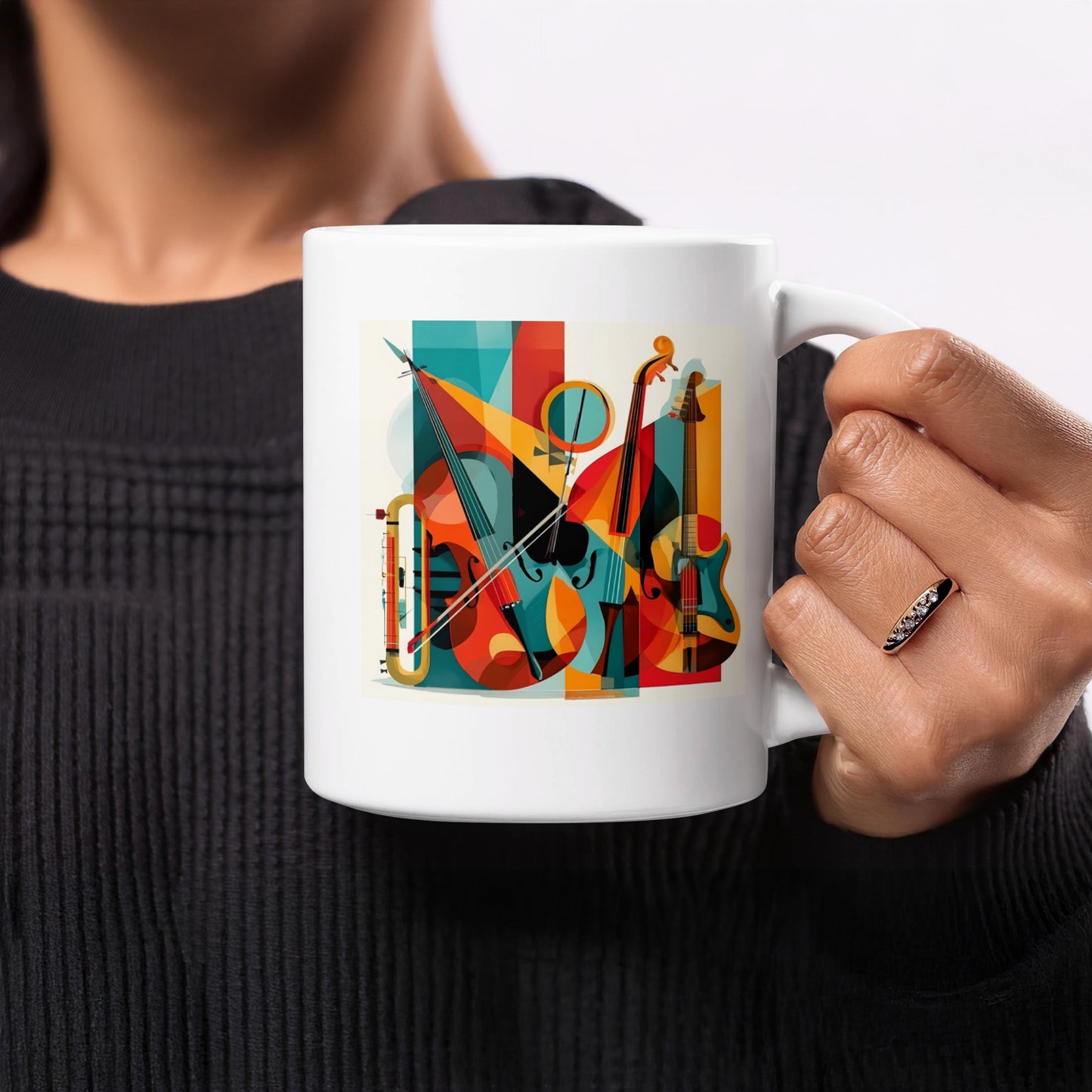 White coffee mug with musical instrument collage featuring violin, cello and guitar forms surrounded by bold geometric colour blocks.