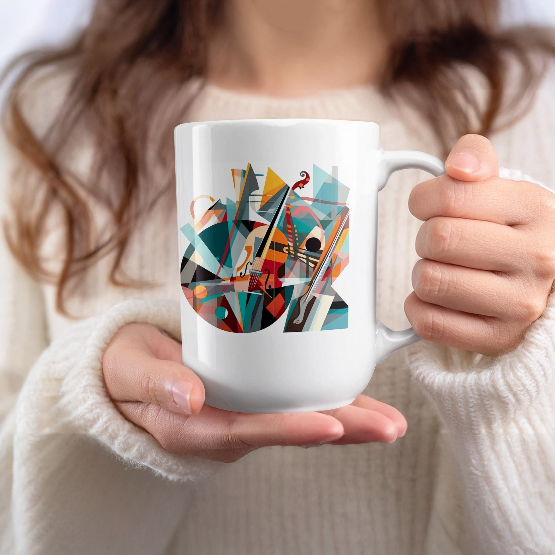 White 15oz mug held in hand featuring expressive violin artwork with colourful geometric styling and abstract forms.