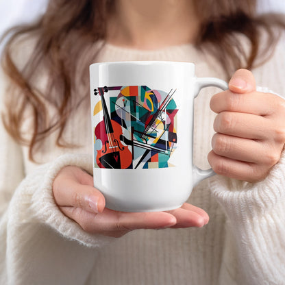 White 15oz mug held in hand featuring expressive cello artwork with bold geometric styling and vibrant colour contrasts.