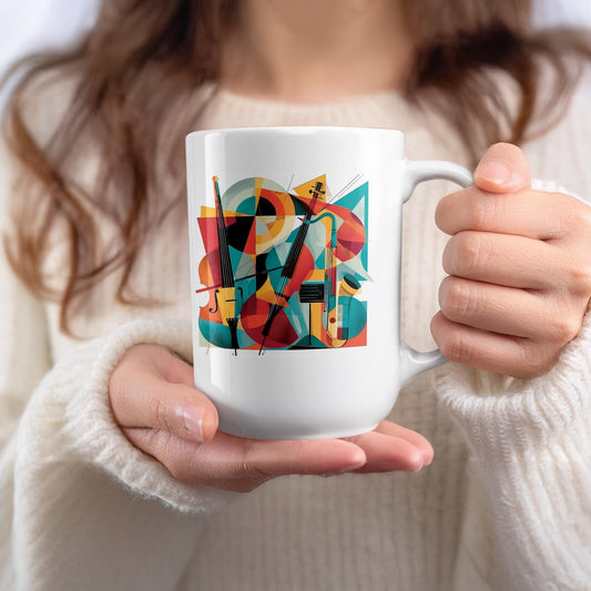 White 15oz mug held in hand featuring expressive twin cello artwork with bold abstract styling and vibrant colour contrasts.