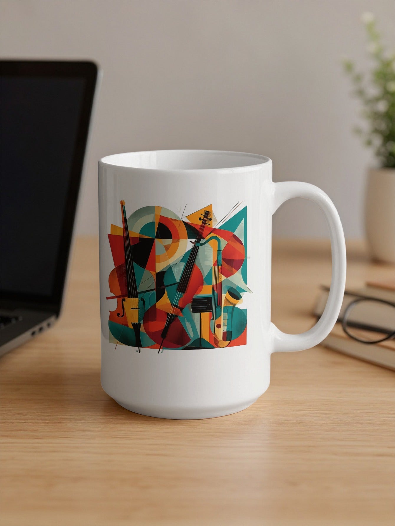 15oz coffee mug on desk showing contemporary music design with two cellos, geometric patterns and flowing diagonal bow lines.