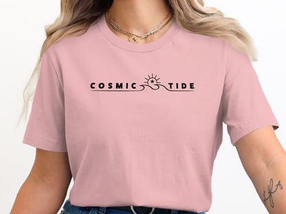 Pink Cosmic Tide T-Shirt with centred celestial-wave graphic combining subtle sun, wave, and star elements in minimalist composition.