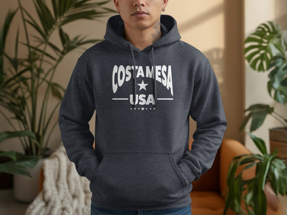 Costa Mesa hoodie, dark heather grey unisex with relaxed fit, drawstrings, cozy texture, and everyday casual layering.