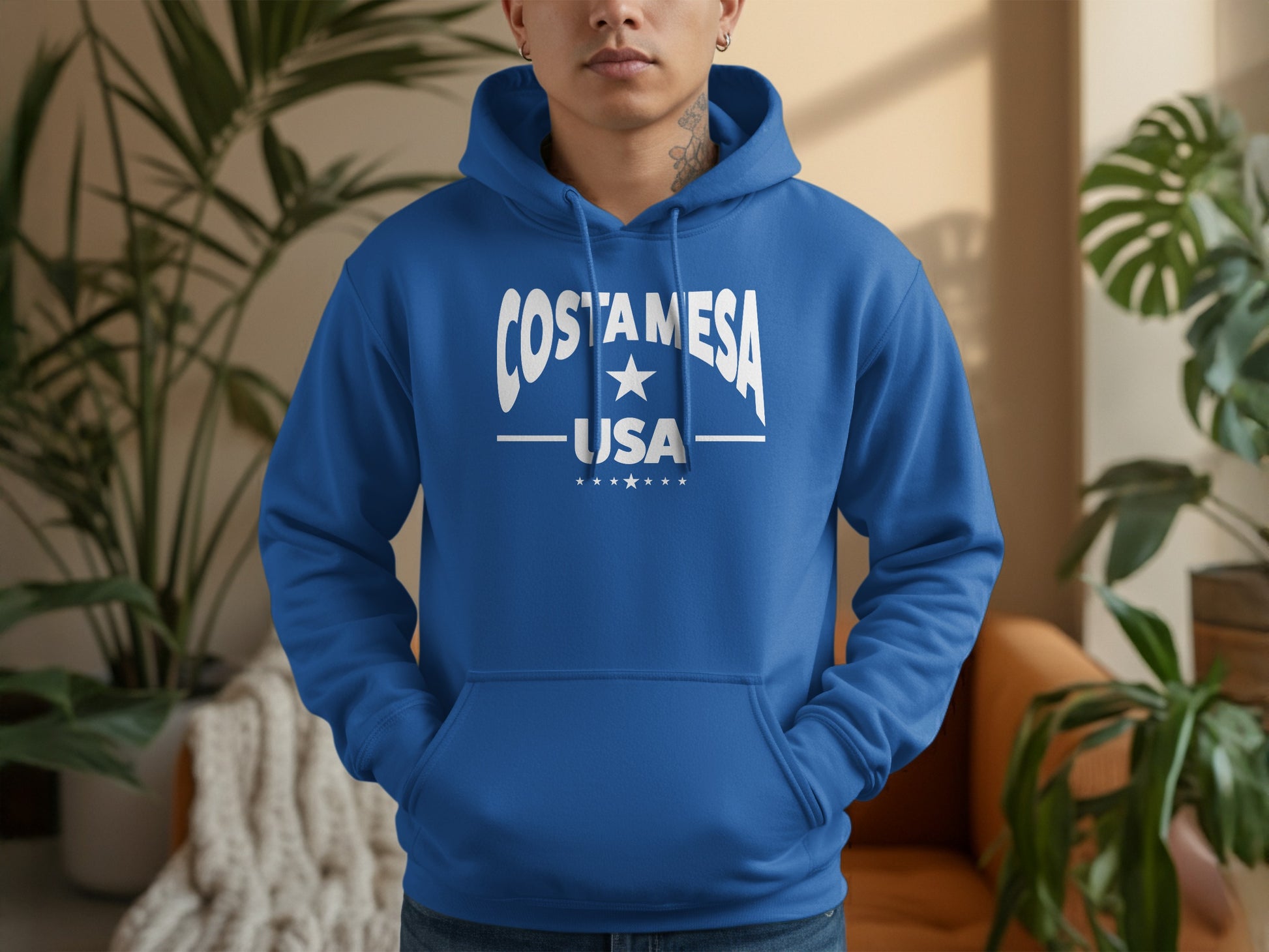 Costa Mesa unisex hoodie, royal blue pullover with relaxed fit, pocket, drawstrings, soft feel, and bold casual look.