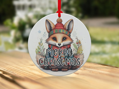 Watercolour fox ornament with festive beanie, red berries, leafy botanicals, and cheerful holiday artwork.