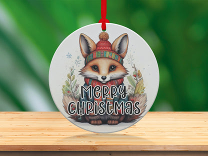 Christmas tree ornament featuring a charming fox portrait, cosy winter accessories, and Merry Christmas lettering.