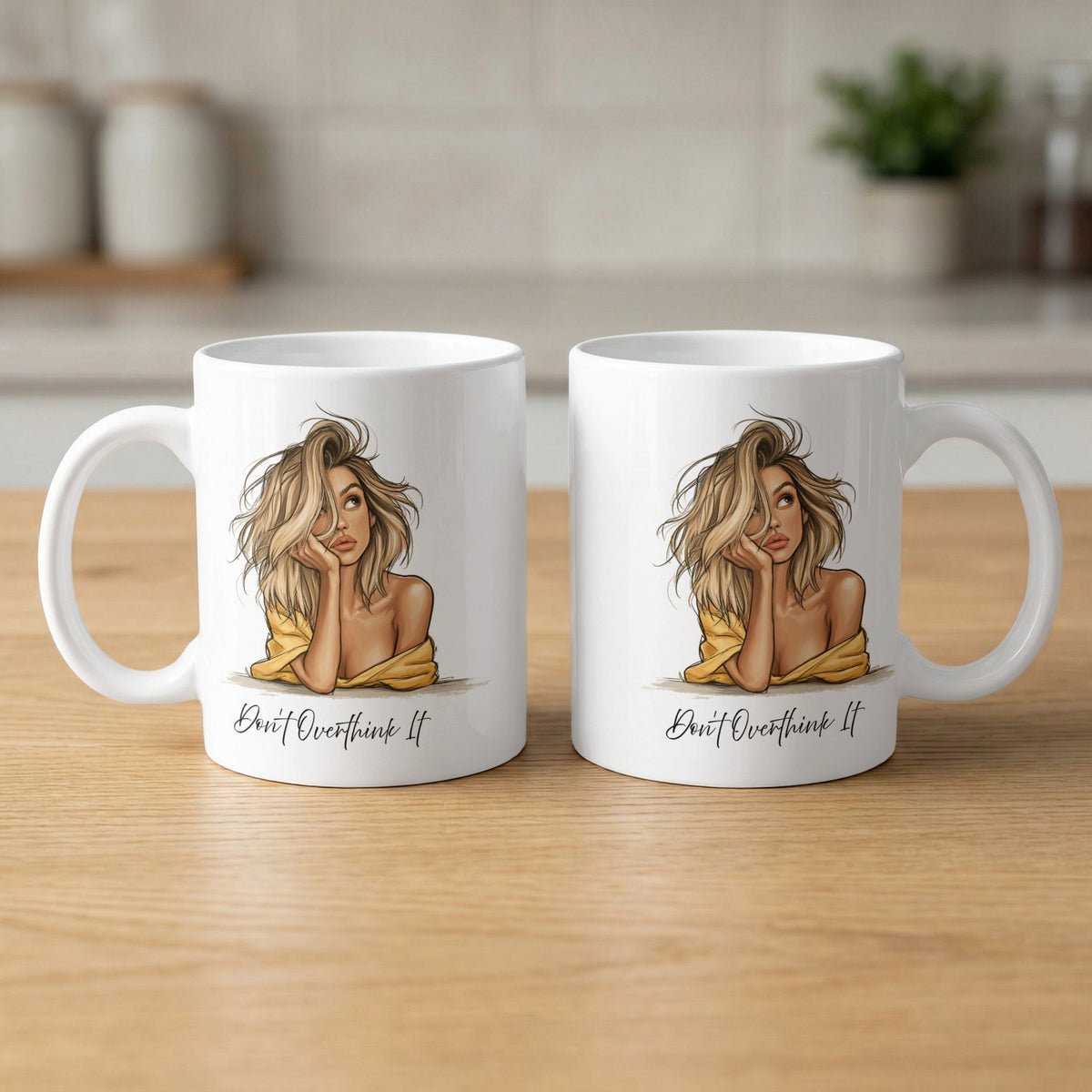 Two 11oz Don't Overthink It Mugs showing front and back with the illustrated portrait, Don't Overthink It black lettering and clean white ceramic.