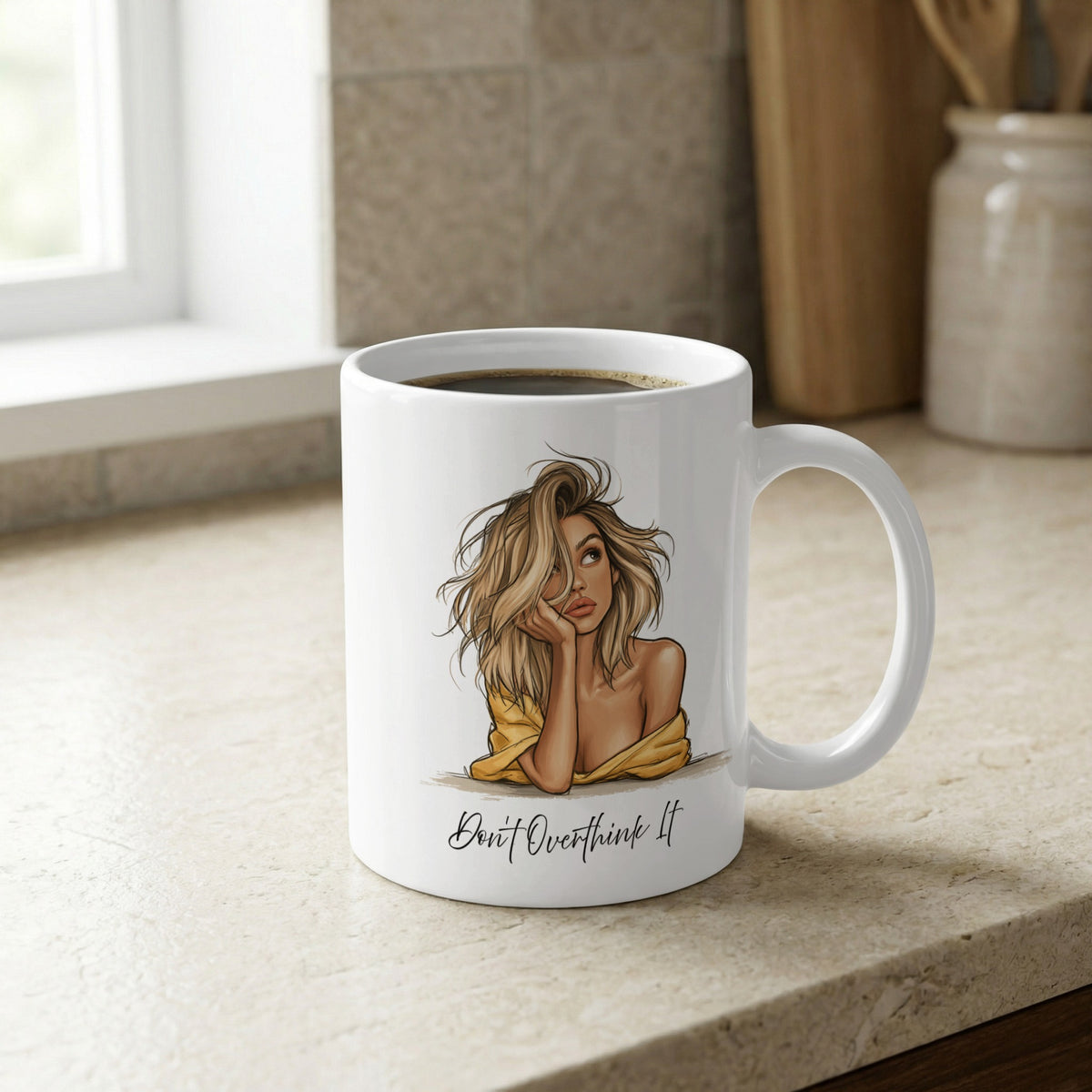 White 11oz Don't Overthink It Mug on a kitchen bench, highlighting the fashion-sketch portrait and soft warm colour palette.