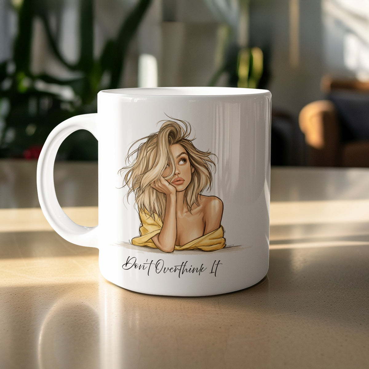 11oz Don't Overthink It Mug featuring an illustrated blonde portrait, warm beige and yellow tones, and playful script on white ceramic.