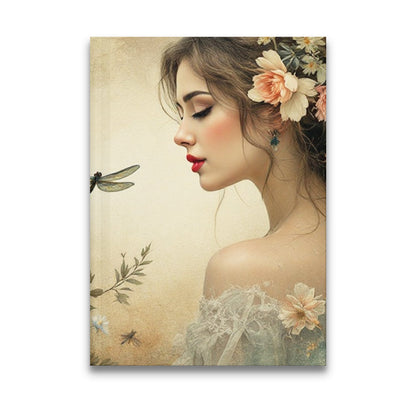 Dragonfly Floral Journal with dark-haired woman, translucent dragonfly, blush peonies and cream dahlias.