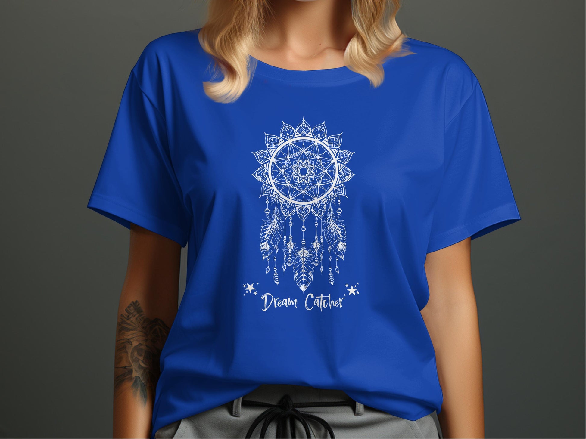 Royal Blue Dream Catcher T-Shirt featuring a balanced white mandala composition with delicate star accent layouts.