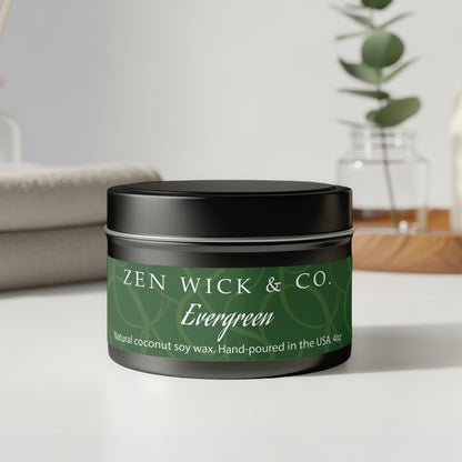 Evergreen tin candle 4oz with lid on displayed on table highlighting sleek design and compact size for decor.