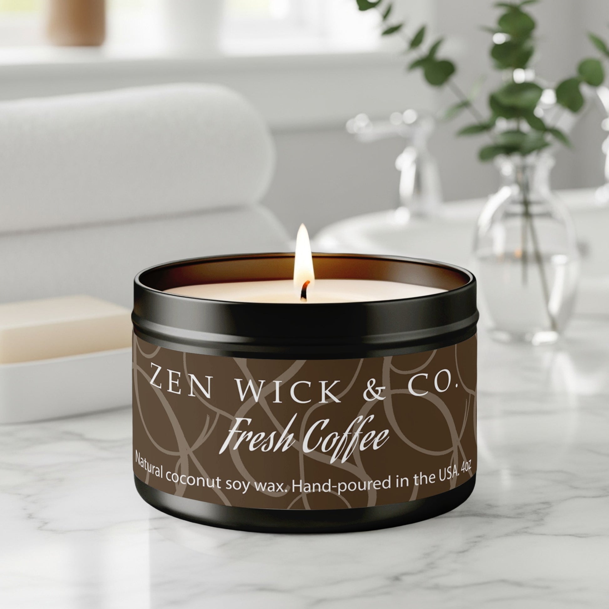 Fresh coffee scented tin candle 4oz burning on table with warm glow creating a cozy café-inspired ambiance.