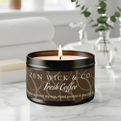 Fresh coffee scented tin candle 4oz burning on table with warm glow creating a cozy café-inspired ambiance.