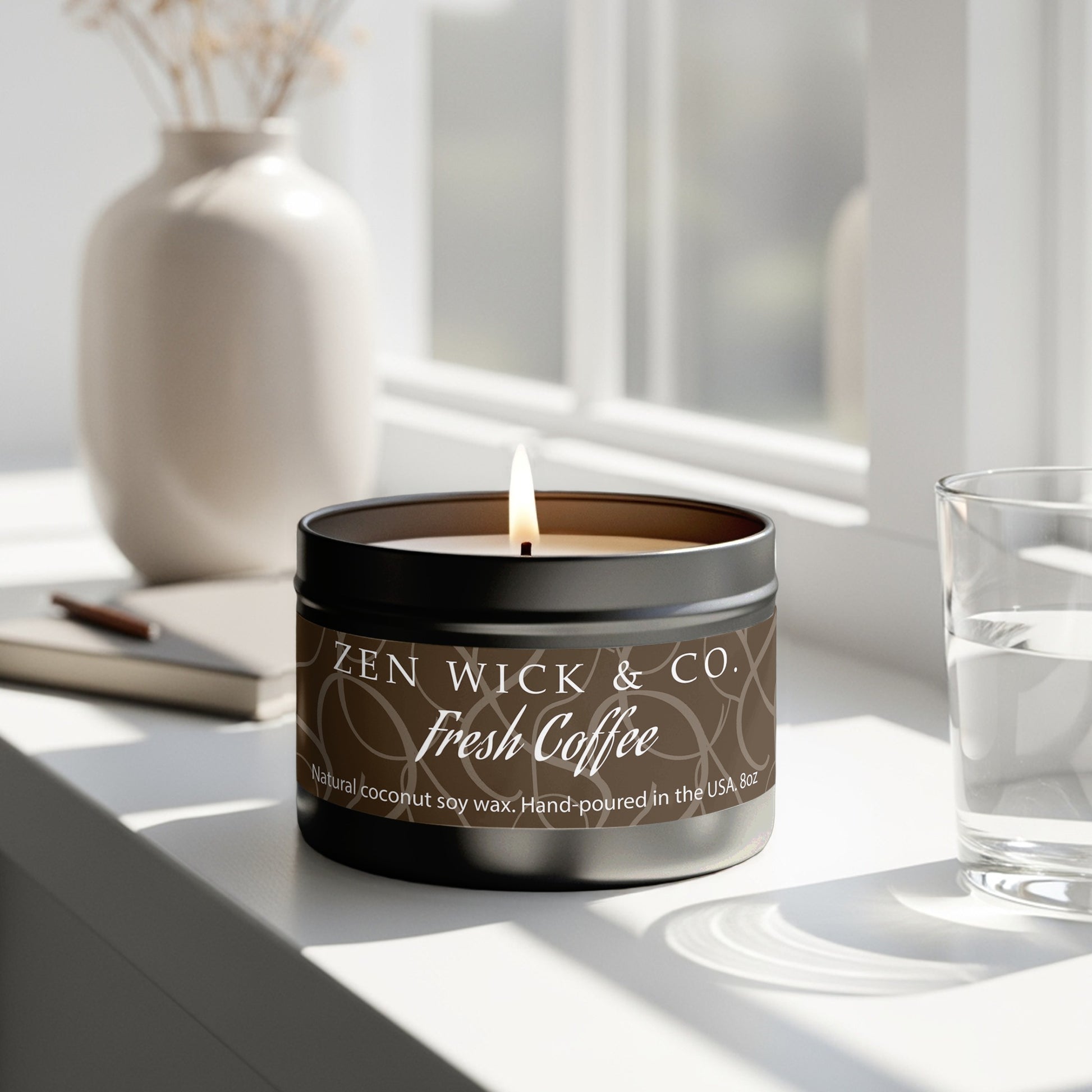 Fresh coffee scented tin candle 8oz burning near window with natural light creating a warm and inviting aroma.
