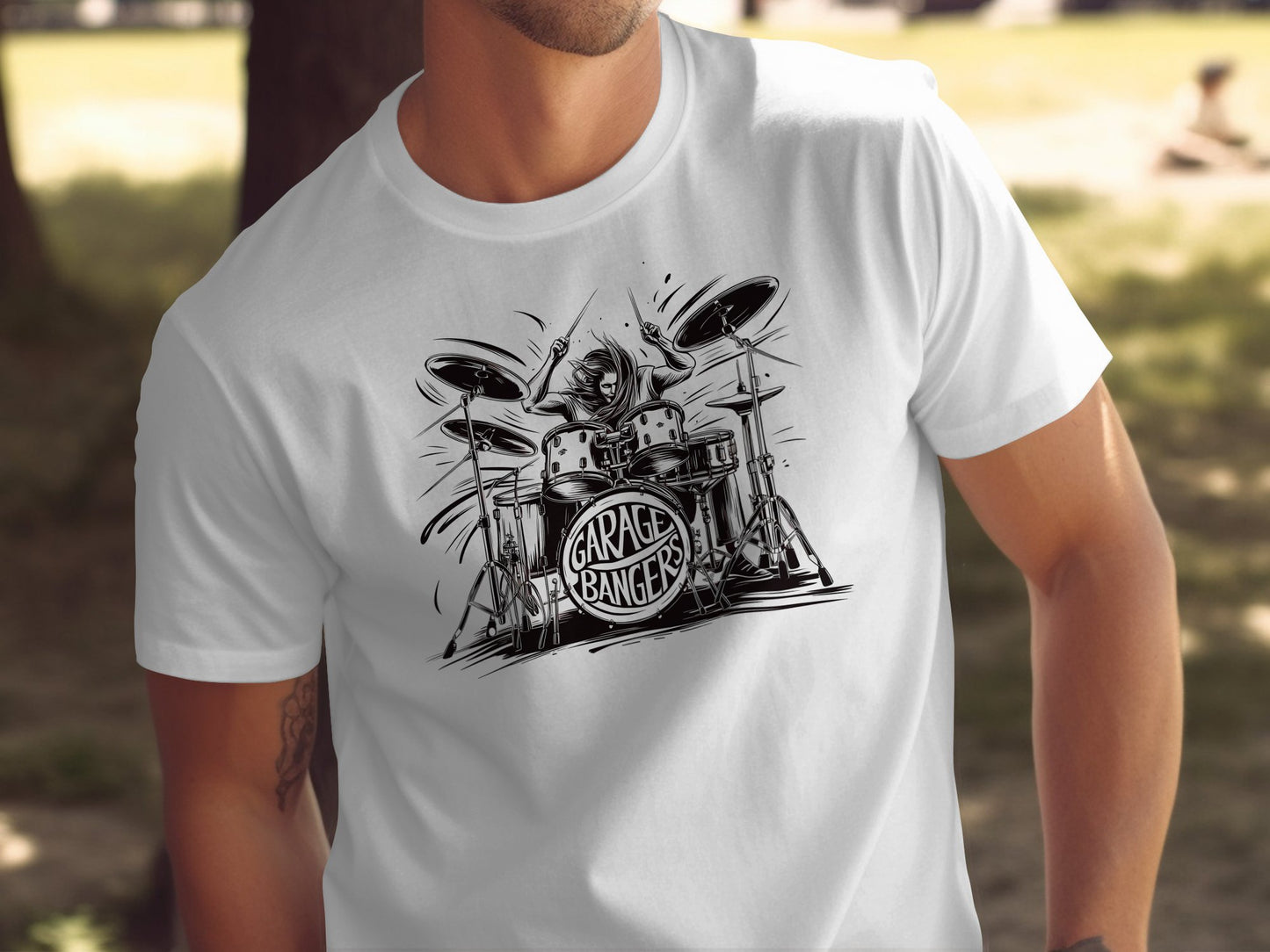White Garage Bangers t-shirt featuring comic style drummer illustration with dynamic motion lines and retro rock drum kit graphic design.