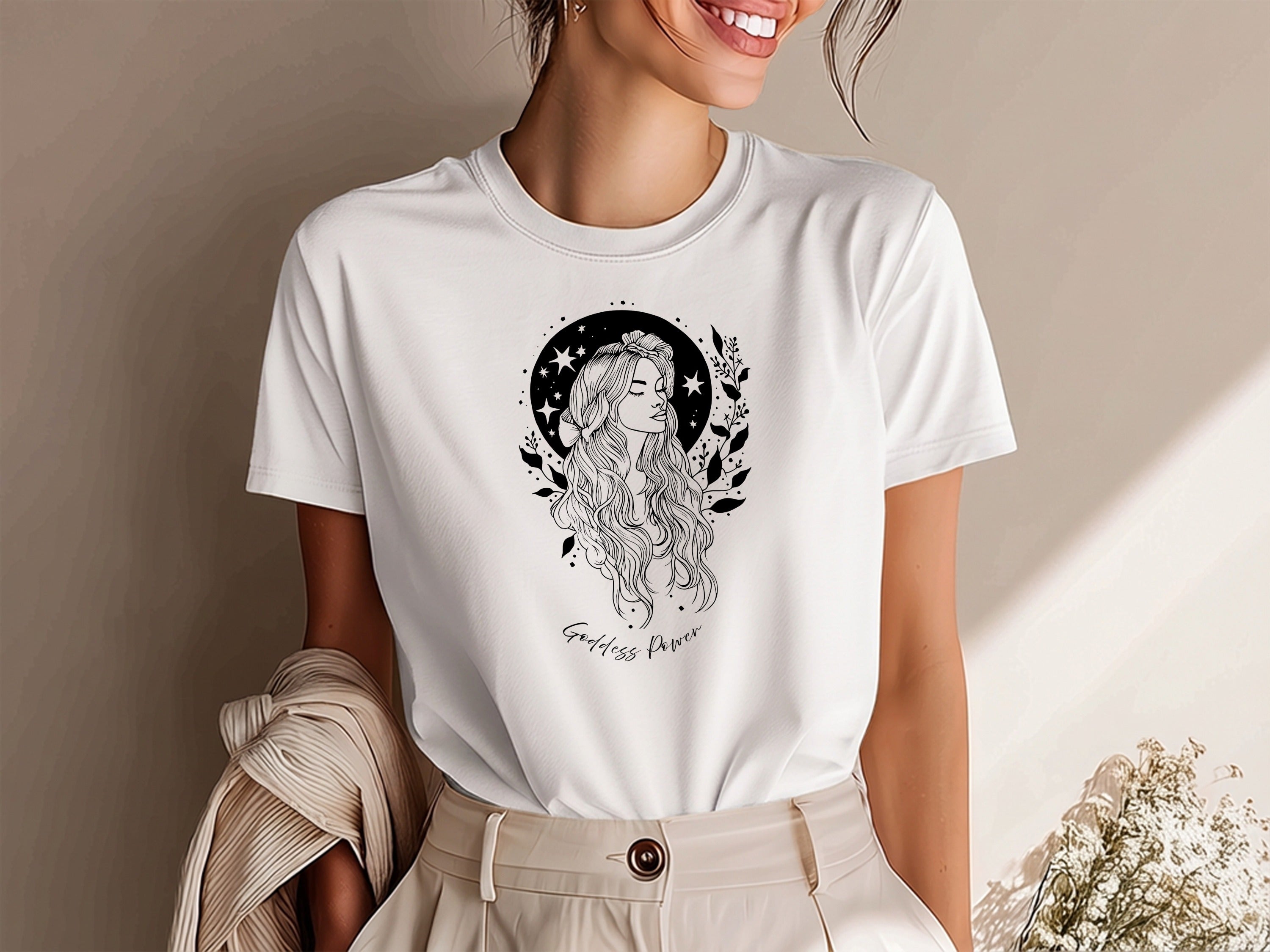 Goddess Power T-Shirt featuring fine-line goddess illustration with star-filled night sky and botanical sprigs.