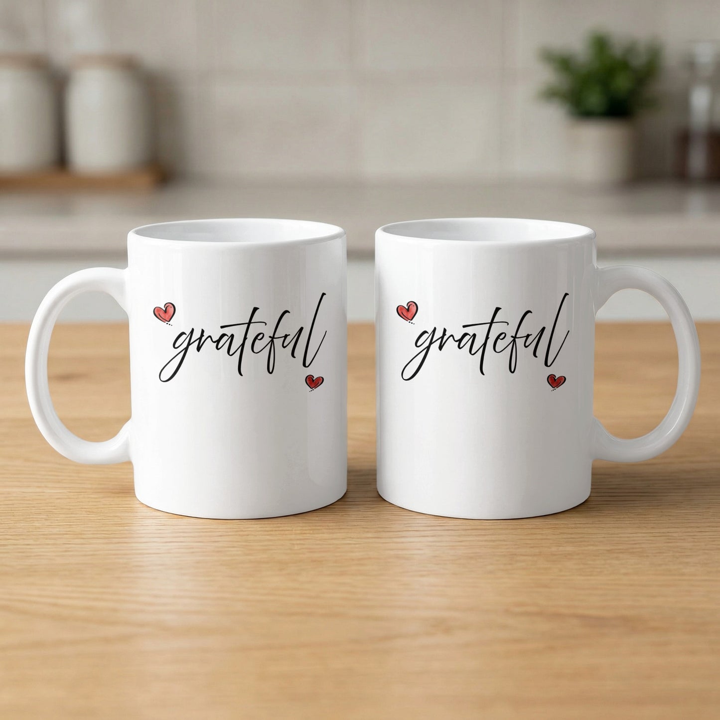 White Grateful Heart Mug showing both sides with matching cursive 'grateful' artwork and two red heart accents.