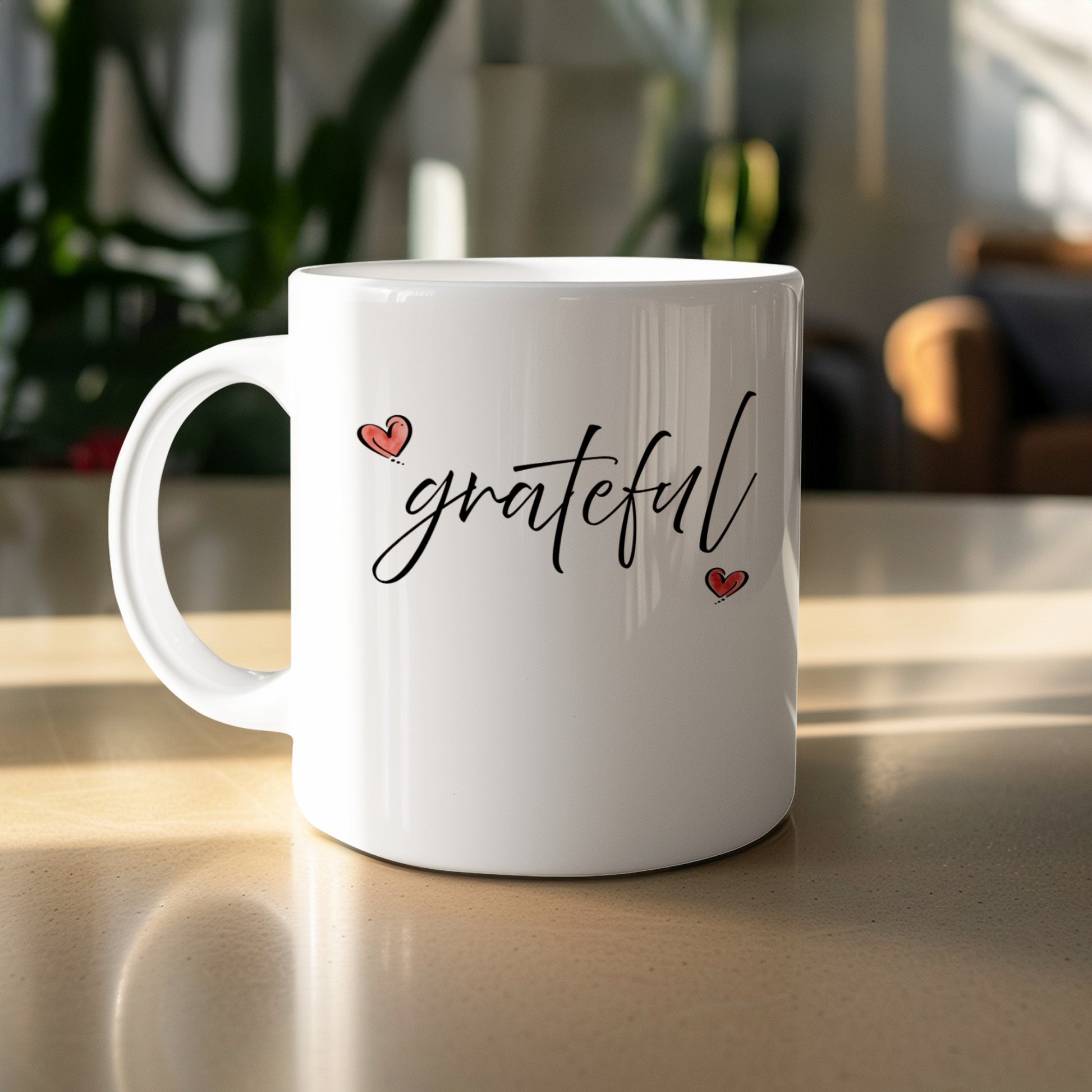 11oz Grateful Heart Mug featuring flowing cursive 'grateful' black lettering and two small hand-drawn red hearts.