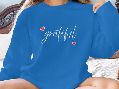 Royal Blue Grateful Heart Sweatshirt with a centre-chest 'grateful' graphic, white cursive text, and red heart accents.