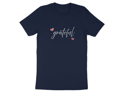 Navy Grateful Heart T-Shirt showing flowing white 'grateful' lettering framed by two small red hand-drawn hearts.