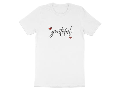 White Grateful Heart T-Shirt flat lay with flowing black cursive 'grateful' lettering and two red hearts creating a balanced centre-chest graphic.